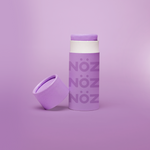 Load image into Gallery viewer, Nöz stick sunscreen in purple with cap off and leaning on side with purple background
